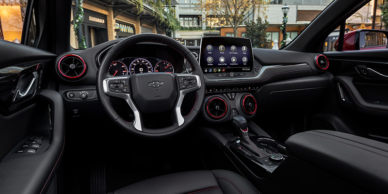 Interior view of a Chevrolet SUV, showcasing modern design, spacious seating, and advanced technology features.