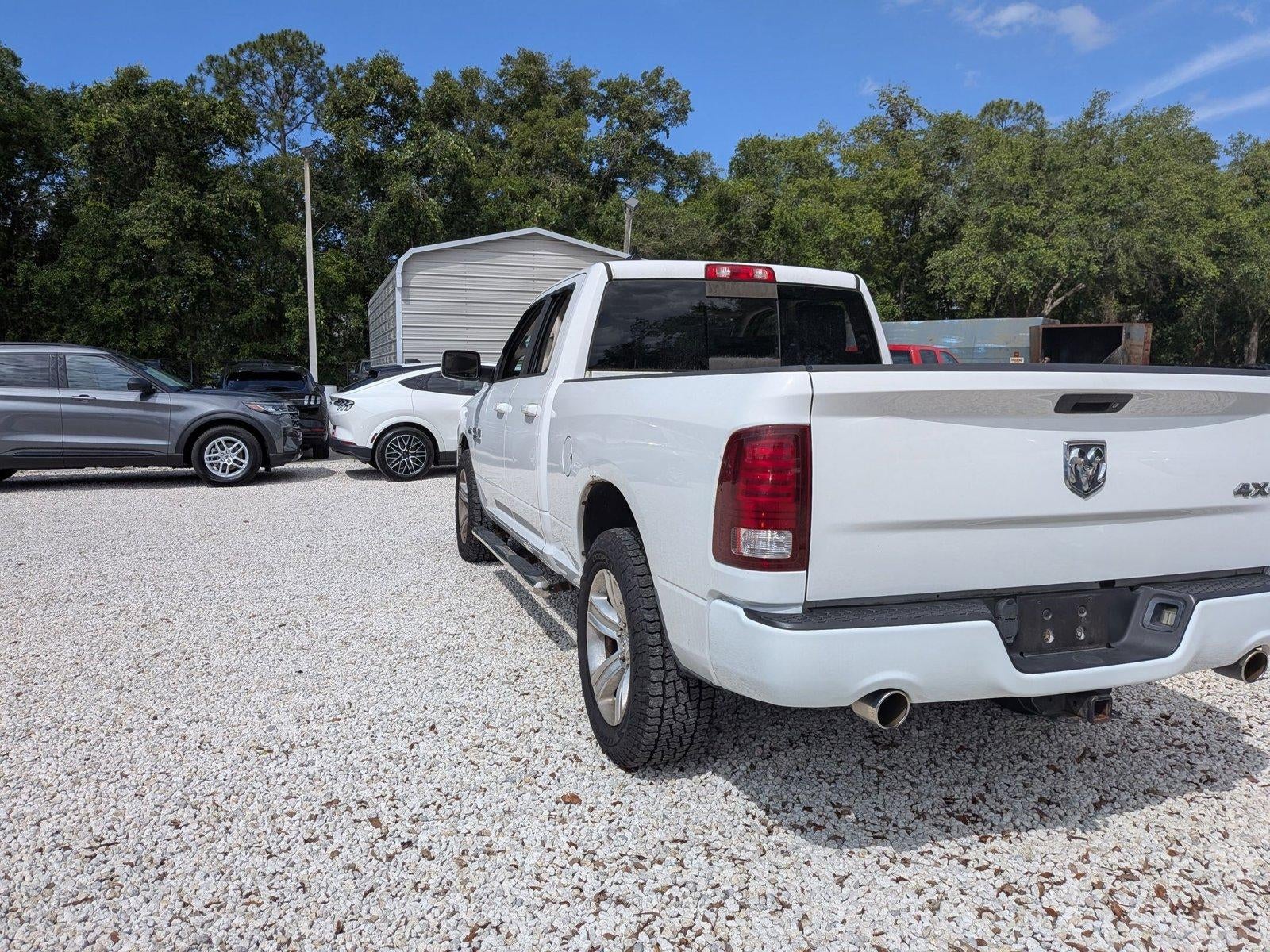 2013 RAM 1500 4WD Quad Cab 6.4 Ft Box Sport